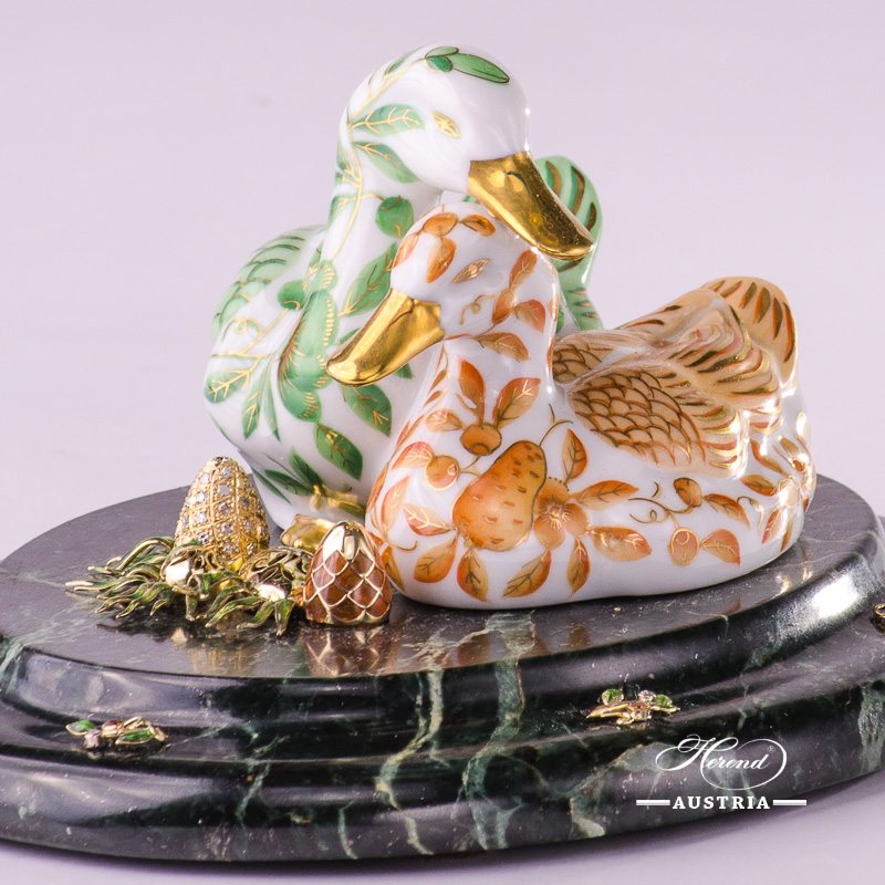 Jewelled Pair of Ducks 5036-0-00 ZOVA-ZO Special Green and Orange pattern. Herend fine china. Hand painted ornaments. Jewelled Pair of Ducks standing on green marble base with 2 pieces of Eggs. Jewelled with: 14 karat Gold - Au 585: 16.2 grams