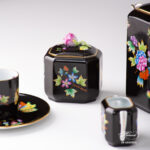Herend Victoria Black coffee set octagonal VE-FN. Black background with Victoria butterflies and peonies.