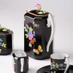 Herend Victoria Black coffee set octagonal VE-FN. Black background with Victoria butterflies and peonies.